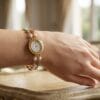 Gold plated pearl floral bracelet watch for women with double chain and daisy charms